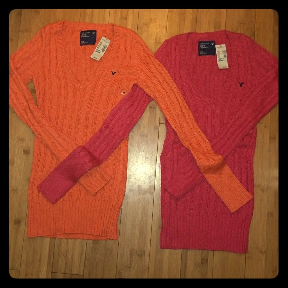 Two bright/hot pink & orange sweaters, very soft.